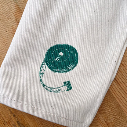 Set of 6 100% cotton Christmas Cracker Napkins by Lottie Day, featuring printed cracker prizes