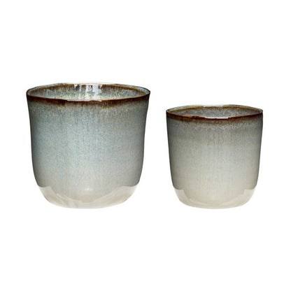 The Every Space ceramic indoor plant pots in blue and beige by Hübsch