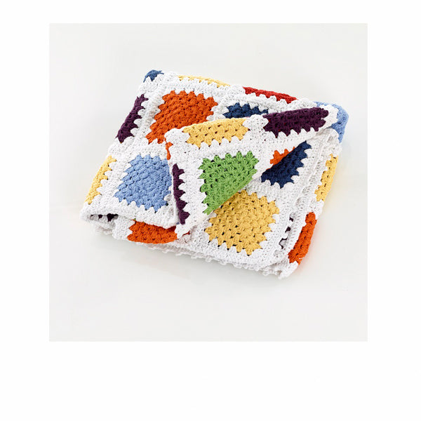 The Every Space handmade new baby Granny Square Blanket in rainbow multicolour crocheted in organic cotton by Pebble Child