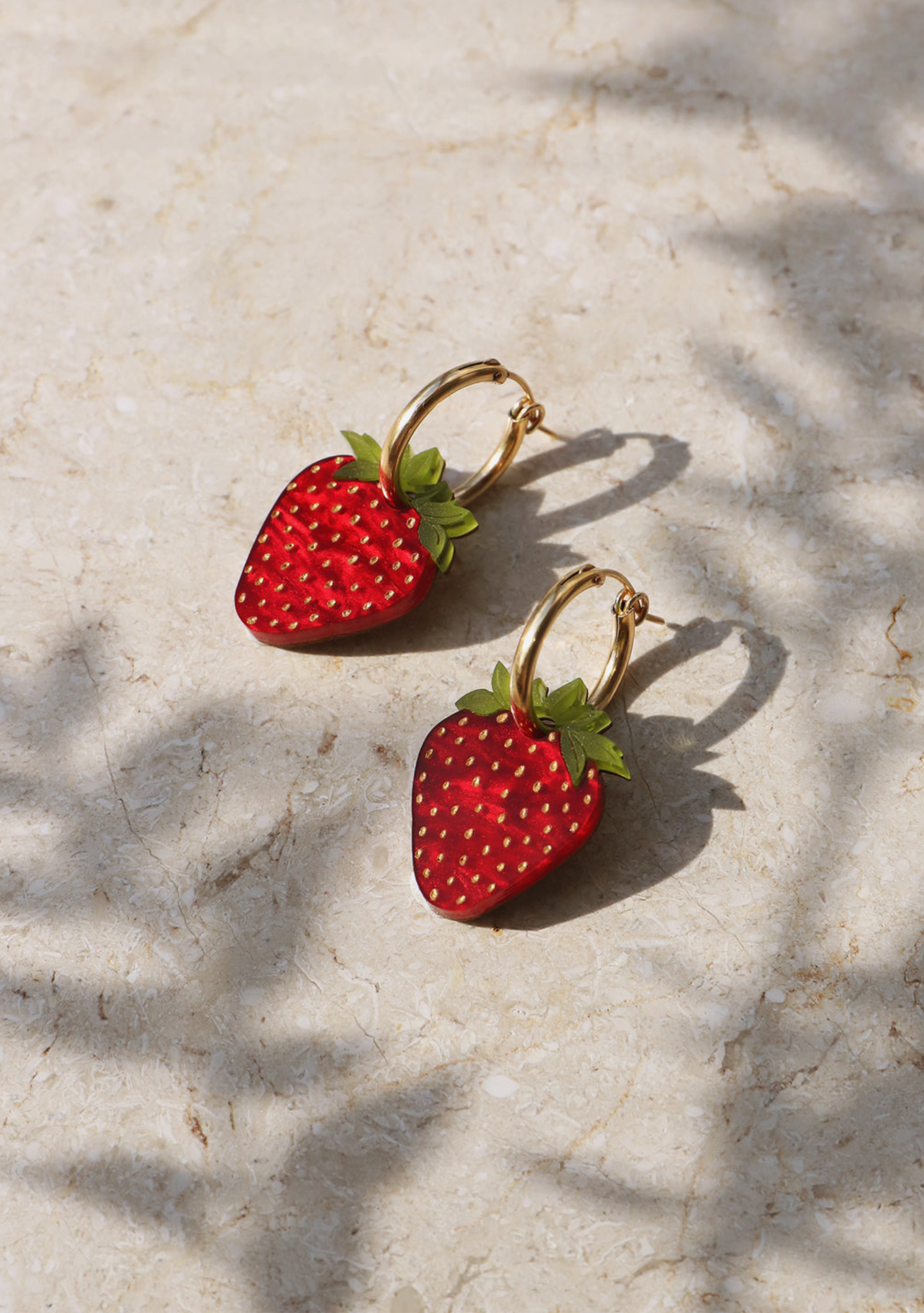 Gold filled hoop earrings with strawberry charms by wolf and moon