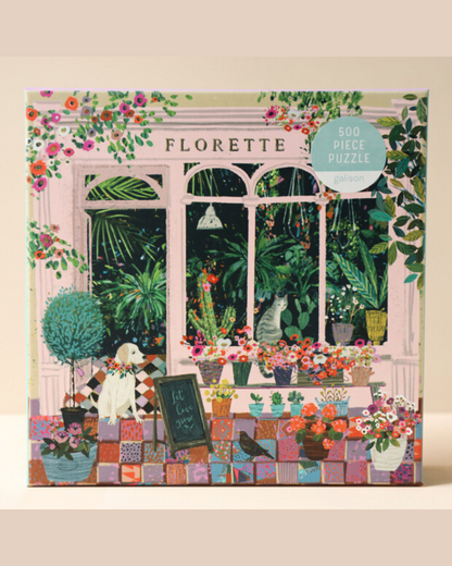 A 500 piece jigsaw puzzle box with a beautiful and colourful picture of a flower shop front