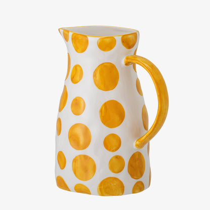 The Every Space stoneware Begonia Jug handpainted with yellow spots and yellow handle by Bloomingville