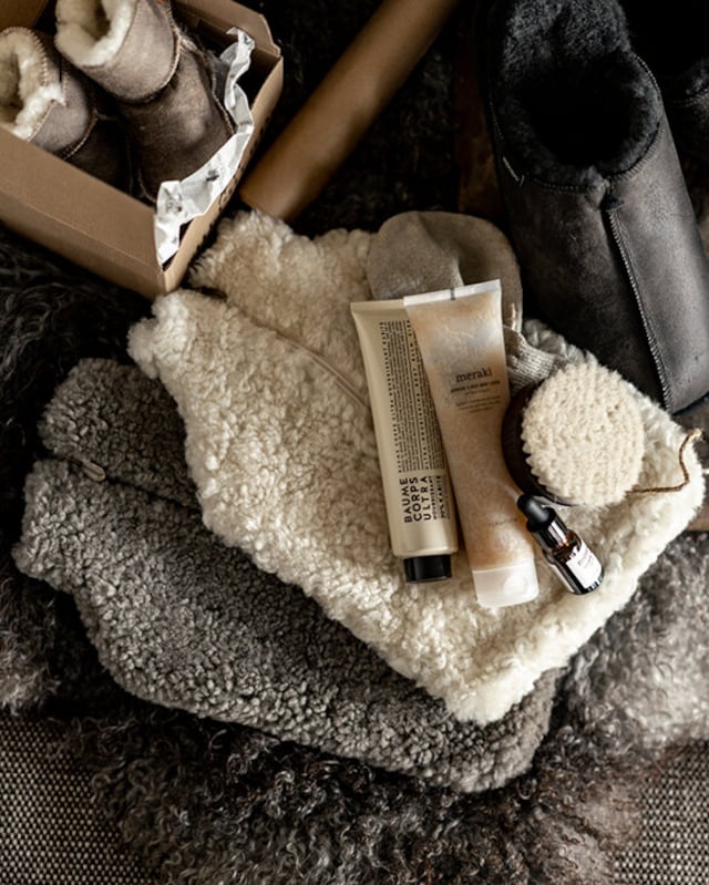 The Every Space Kerri sheepskin hot water bottle cover in creme and stone by Shepherd of Sweden is super soft with a zipper front