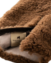 The Every Space Kerri sheepskin hot water bottle cover in Rusty Brown by Shepherd of Sweden is super soft with a zipper front