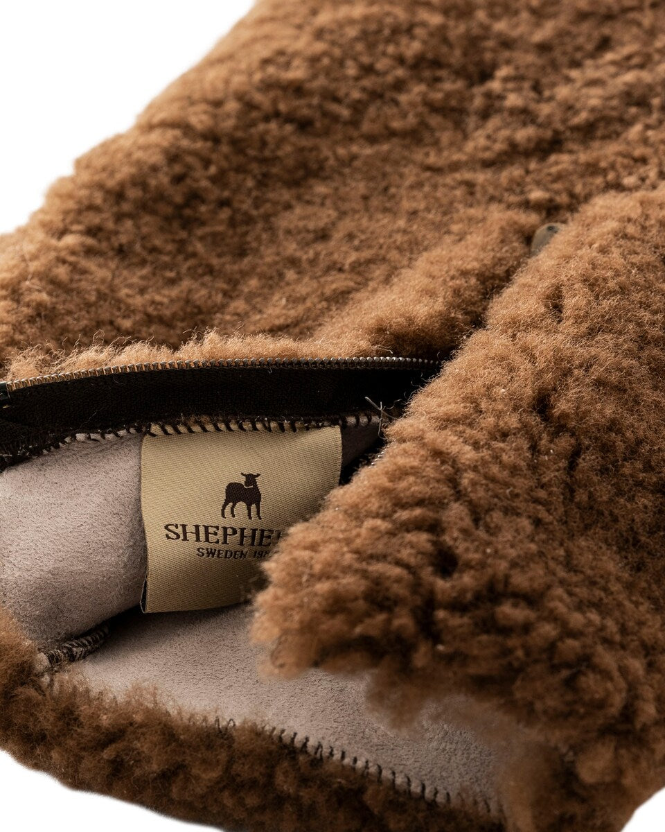 The Every Space Kerri sheepskin hot water bottle cover in Rusty Brown by Shepherd of Sweden is super soft with a zipper front