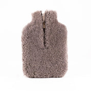 The Every Space Kerri sheepskin hot water bottle cover in stone by Shepherd of Sweden is super soft with a zipper front
