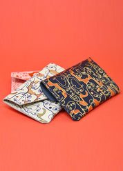 Many Faces Popper Purse