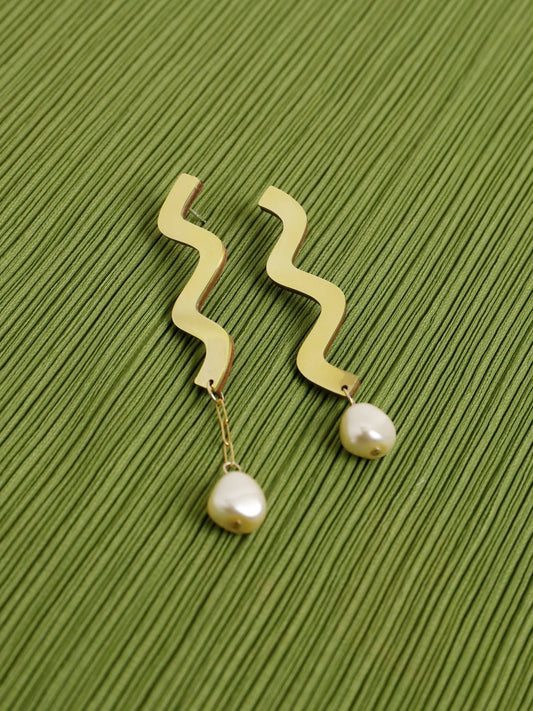 Wavy asymmetric statement earrings made in brass with Wolf & Moon's signature wood base, Czech glass baroque pearls, 14k gold-filled chain and sterling silver earring posts. 