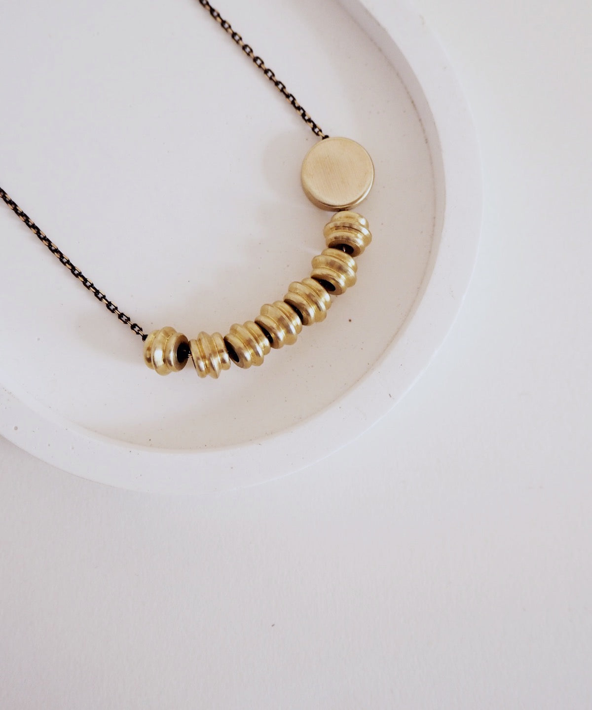 nucleo-totem-disc-necklace.jpg