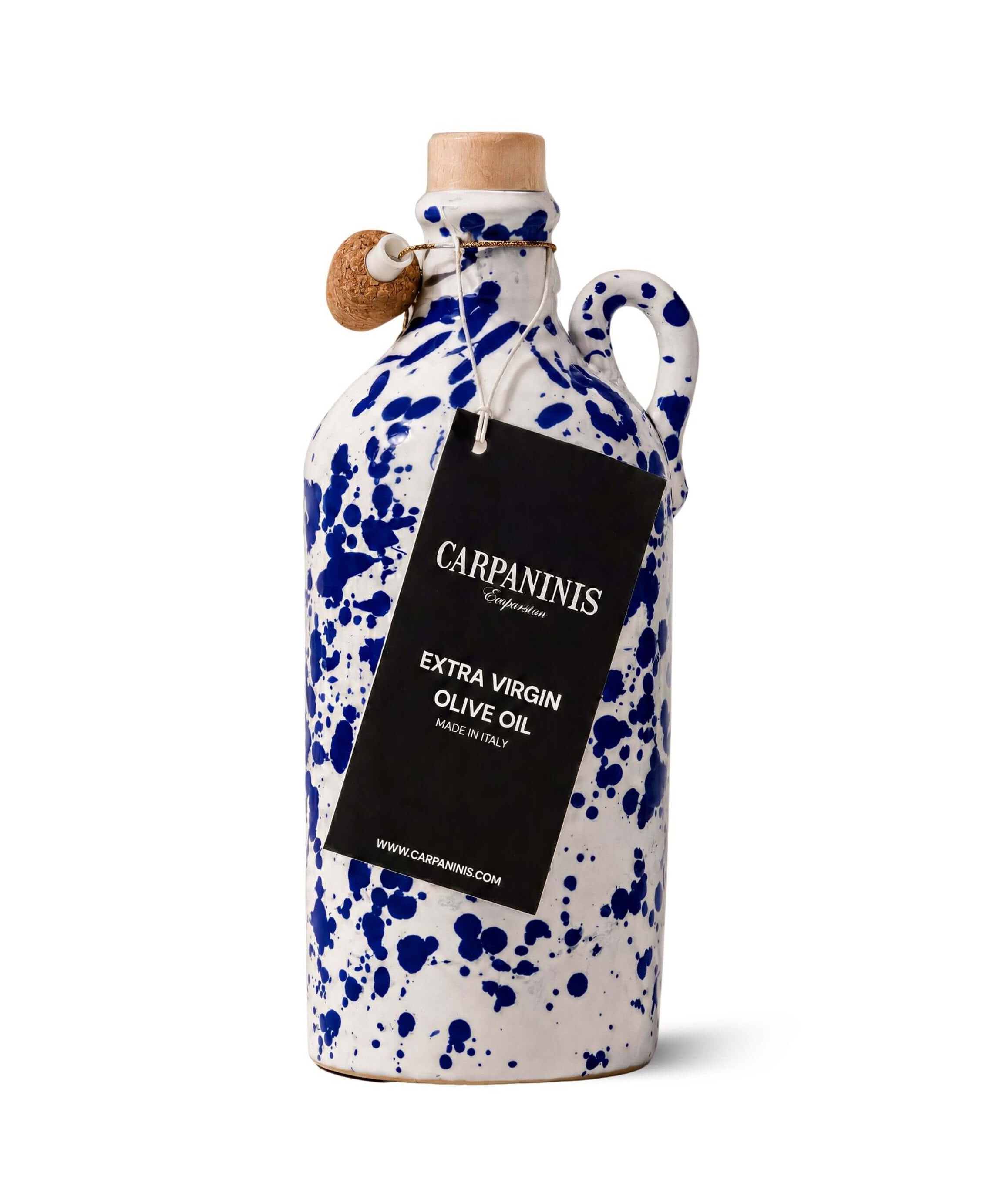 A Carpaninis ceramic olive oil bottle with a white glaze, blue speckled pattern, and a cork stopper, featuring a black hanging label that reads 'Carpaninis Extra Virgin Olive Oil'.