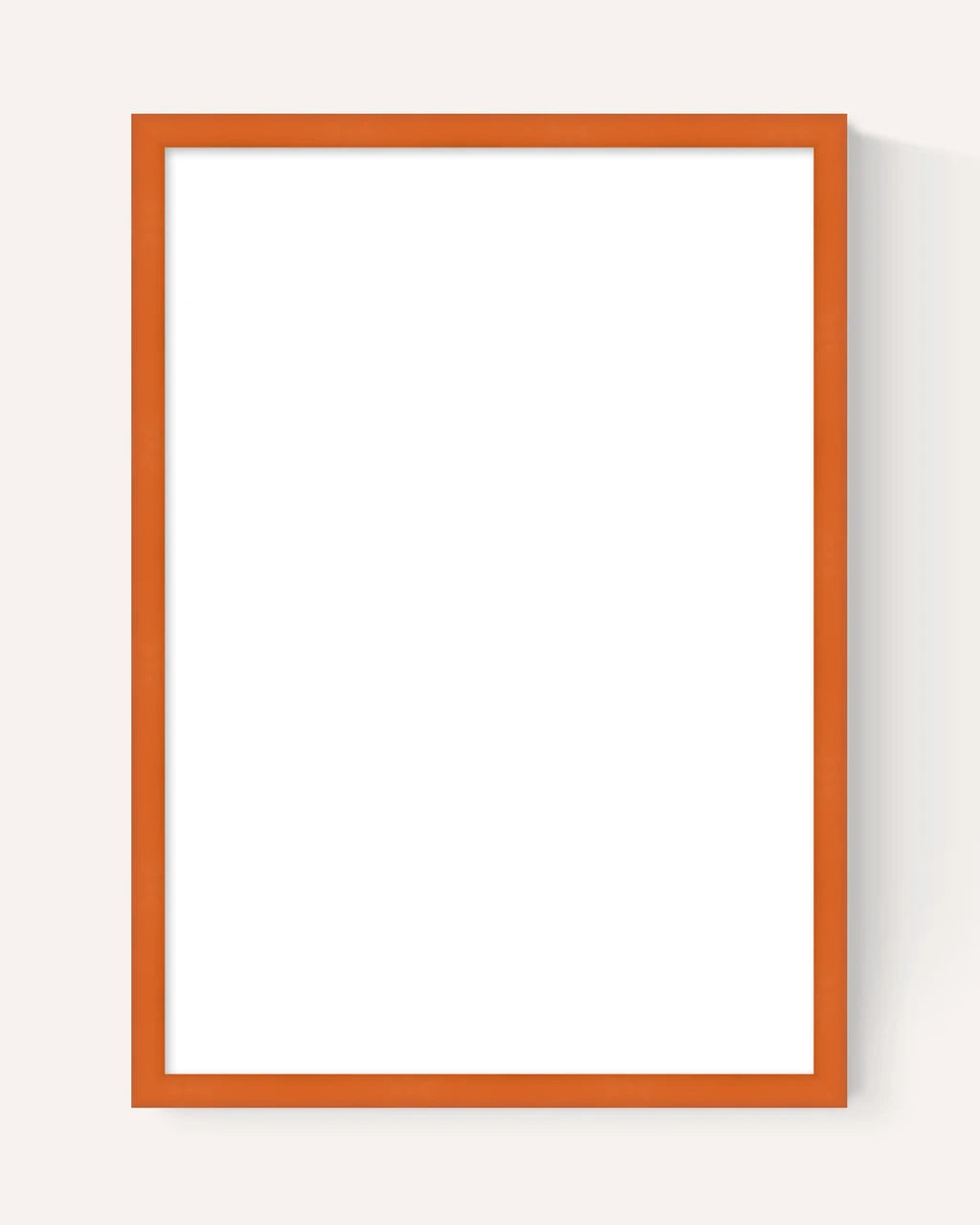 A minimalist vertical picture frame with a thin orange-brown border and a blank white center, shown against a light beige background with a soft drop shadow.
