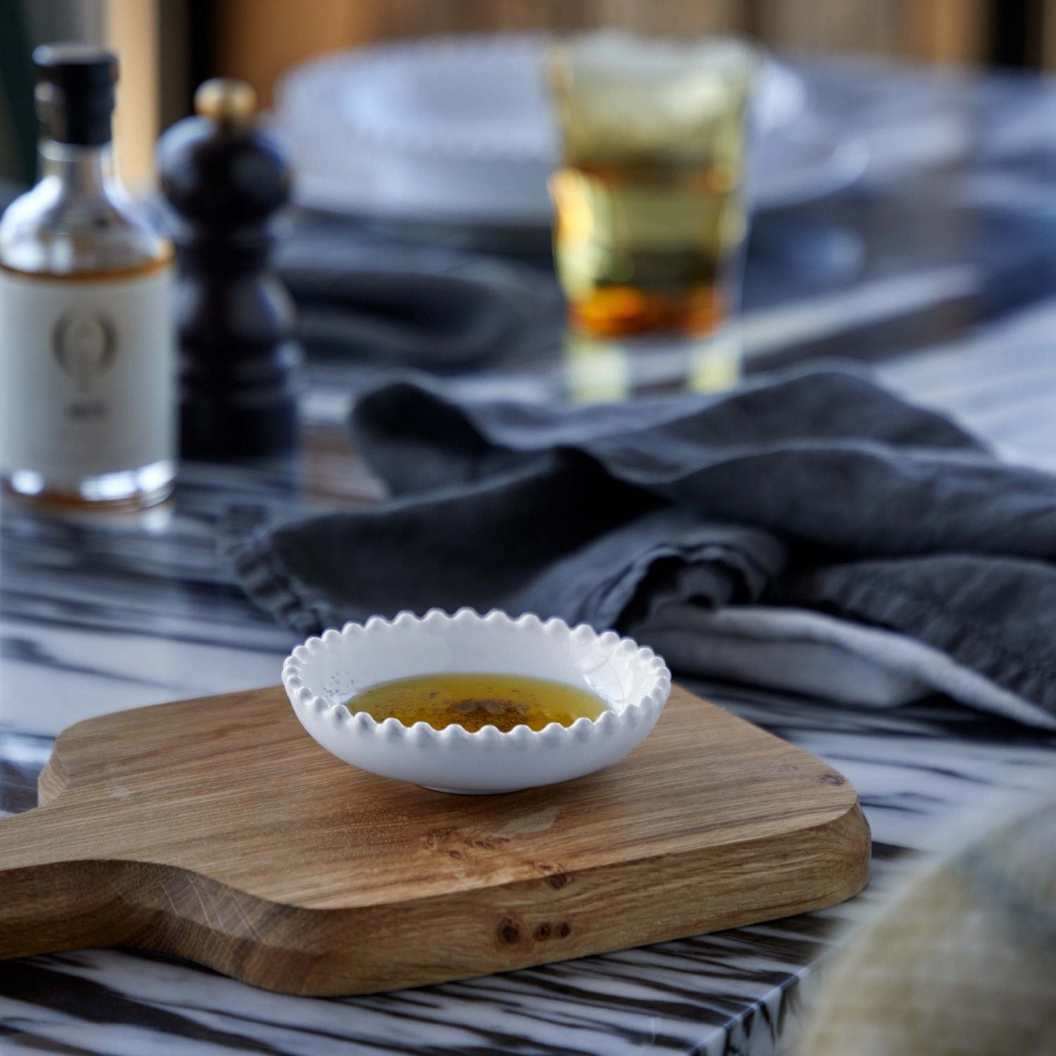 The Every Space fine stoneware mini white bowl with pearl style edging detail by Costa Nova