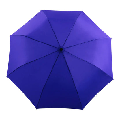 The Every Space compact, eco-friendly and lightweight, Royal Blue Umbrella, with 100% recycled, wind resistant fabric on a high-strength steel frame, sustainably sourced birch handle made from one solid piece of wood, and automatic open button, by Original Duckhead.