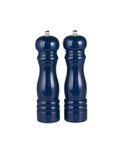 Pair of navy blue salt and pepper shakers on a white background