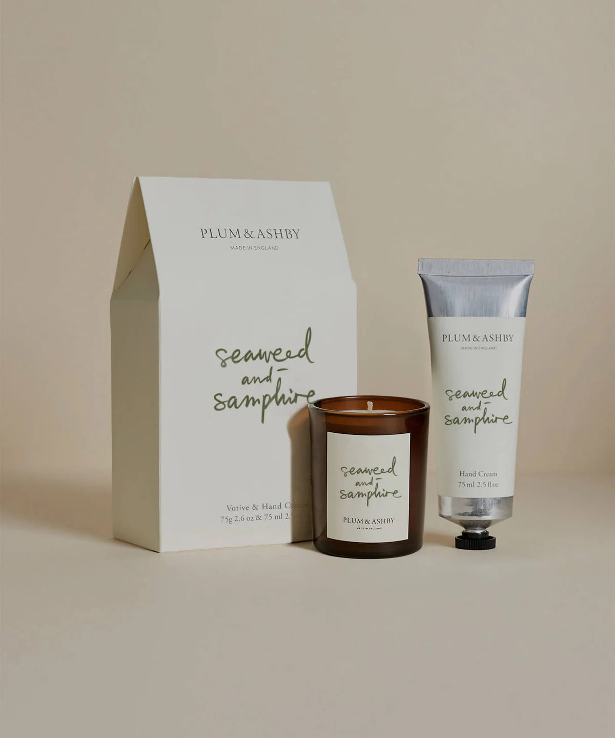 Plum & Ashby Seaweed and Samphire candle and hand cream set in front of the gift box