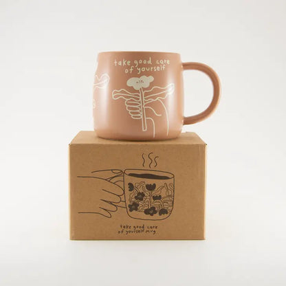 The Every Space dusky pink mug with 'take good care of yourself' text and floral design by People I've Loved