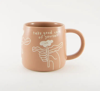 The Every Space dusky pink mug with 'take good care of yourself' text and floral design by People I've Loved