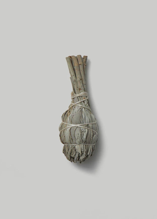 Bundled white sage on a grey background