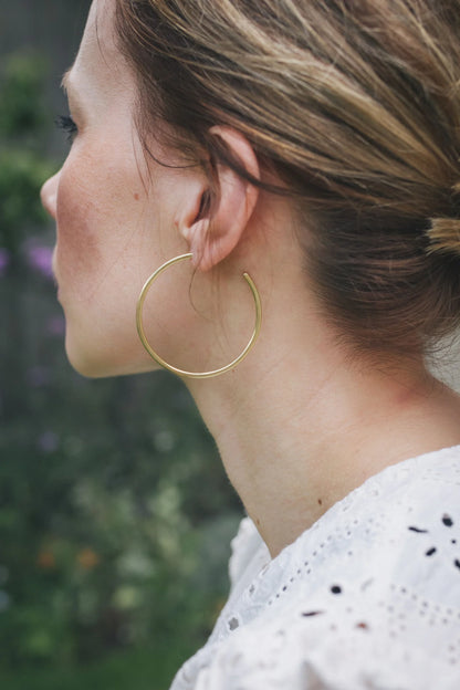 The Every Space brass hoops made using recycled brass by Clare Elizabeth Kilgour, with sterling silver pins and scrolls