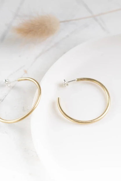 The Every Space brass hoops made using recycled brass by Clare Elizabeth Kilgour, with sterling silver pins and scrolls