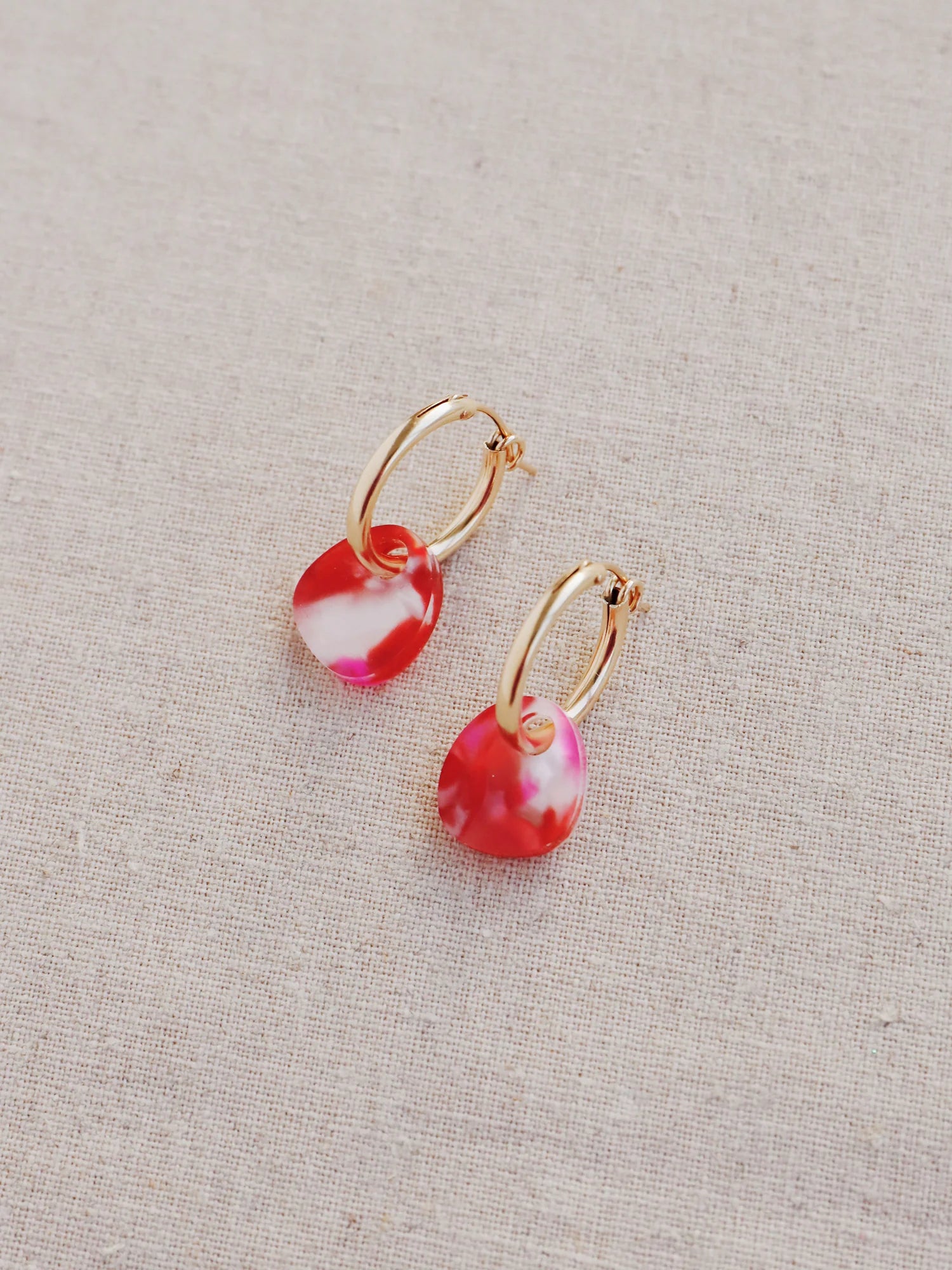 The Every Space Beatrice hoop earrings in filled gold and raspberry acrylic by Wolf & Moon