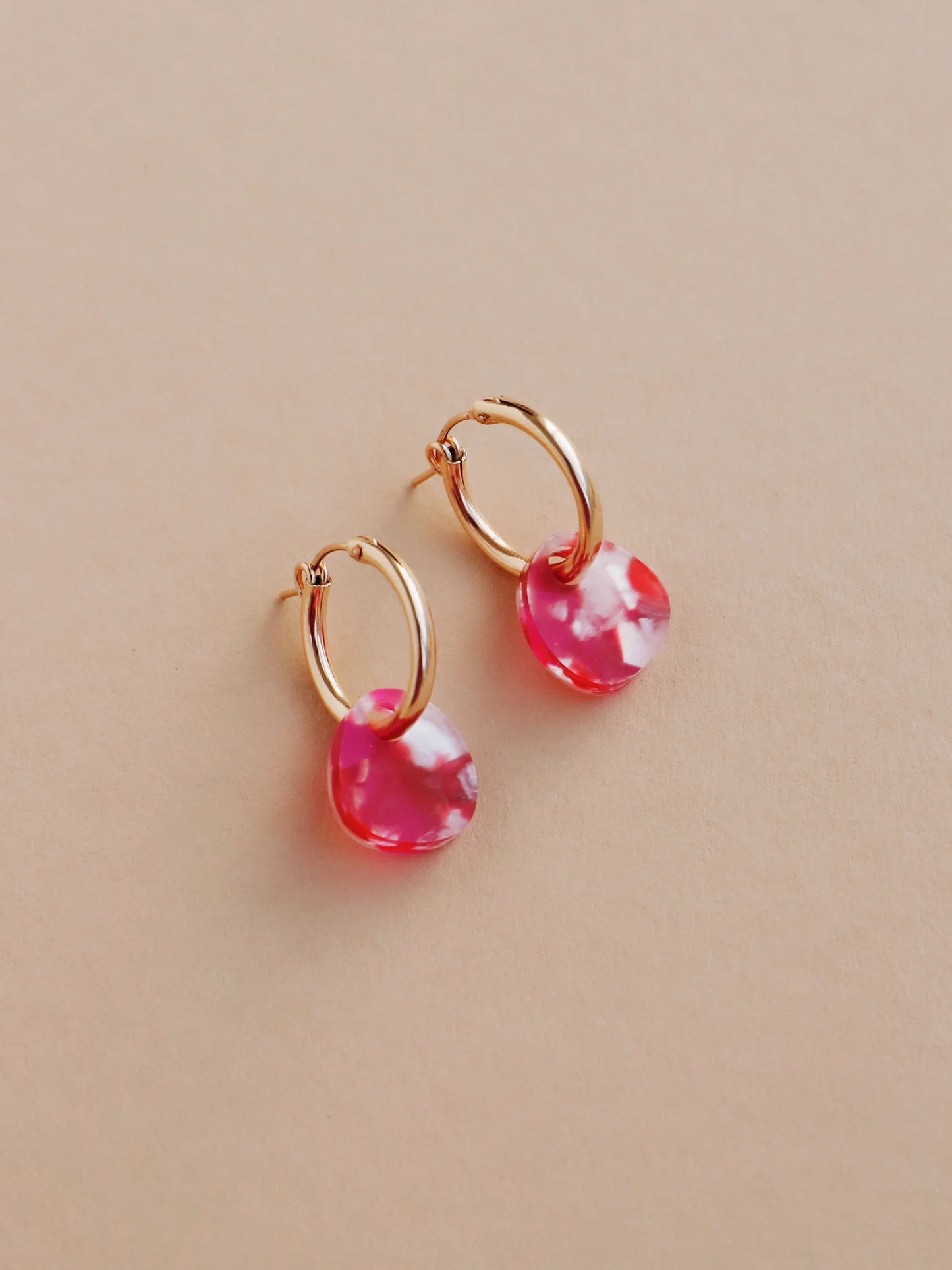 The Every Space Beatrice hoop earrings in filled gold and raspberry acrylic by Wolf & Moon