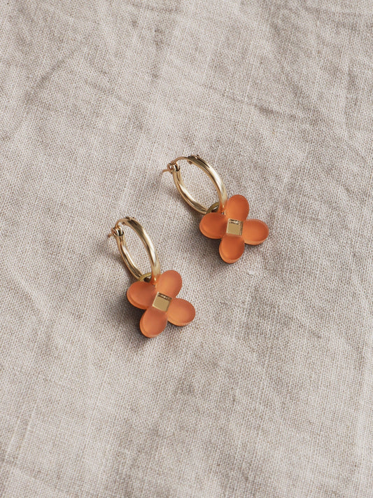 The Every Space Bella hoop earrings in filled gold and terracotta acrylic by Wolf & Moon