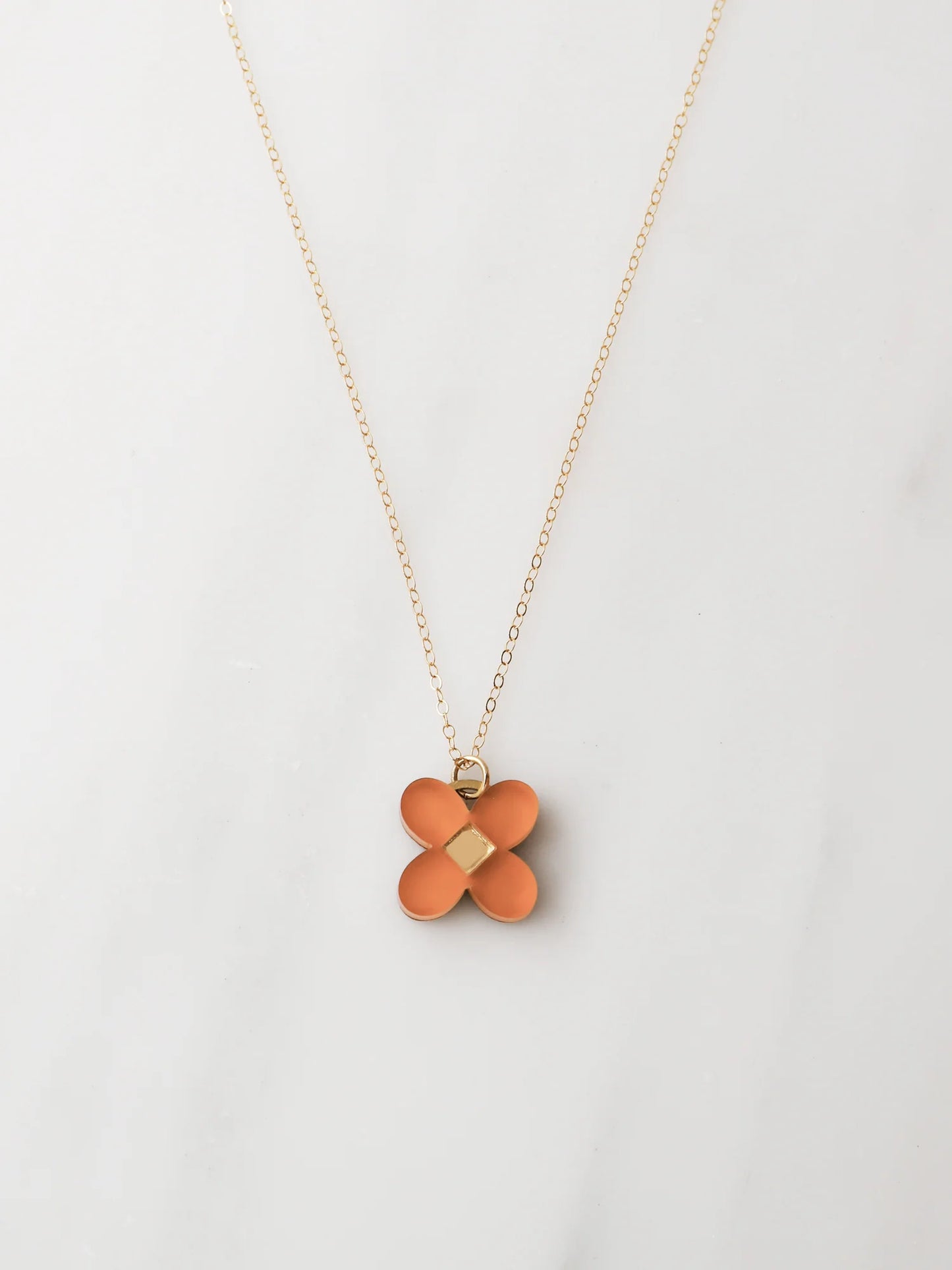The Every Space Bella necklace with filled gold chain and terracotta acrylic pendant by Wolf & Moon