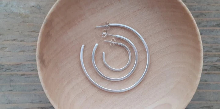 The Every Space silver hoop earrings handmade using recycled silver by Clare Elizabeth Kilgour, with sterling silver pins and scrolls