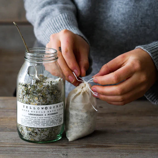 The Every Space glass jar of Energising Rosemary & Lemongrass Muscle Relief Bath Soak with Epsom bath salts by Yellow Gorse