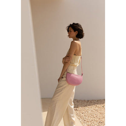 The Every Space high quality grain pink bloom vegan leather Half Moon shoulder bag with a black YKK zipper and an internal pocket by Monk & Anna