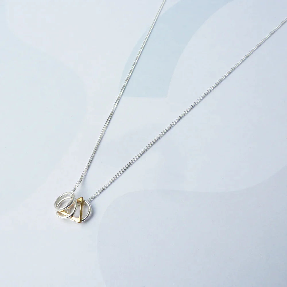 The Every Space Jessie necklace with sterling silver chain and sterling silver & gold filled charms by Custom Made UK