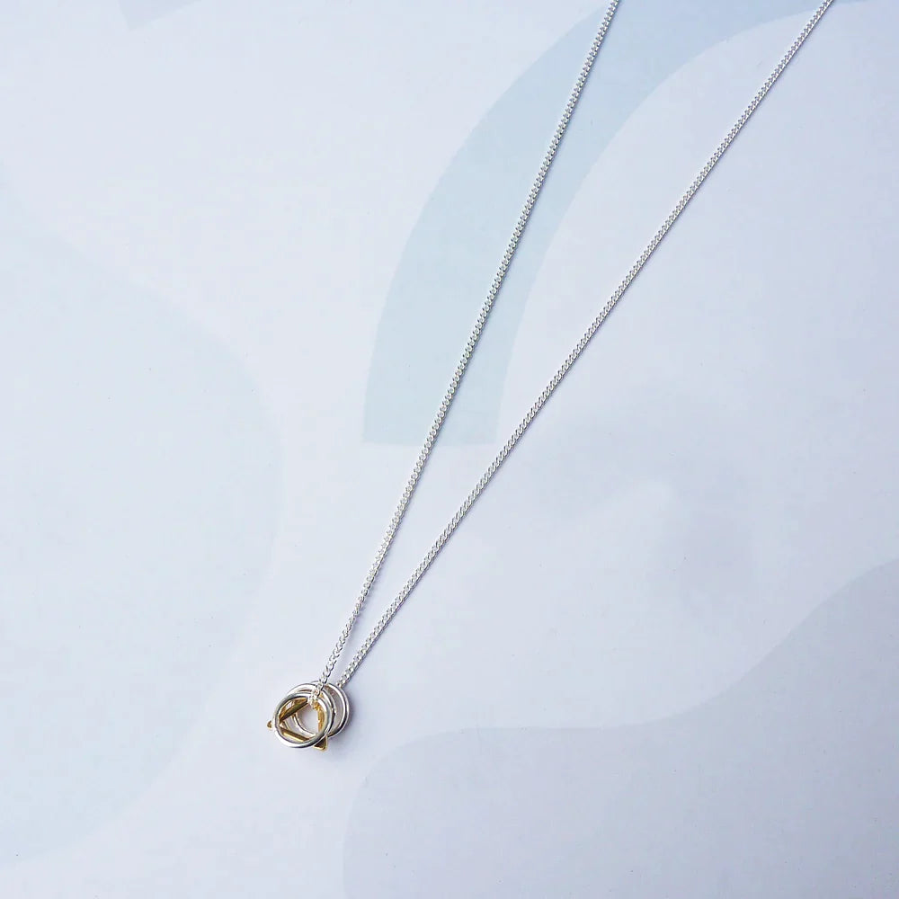 The Every Space Jessie necklace with sterling silver chain and sterling silver & gold filled charms by Custom Made UK