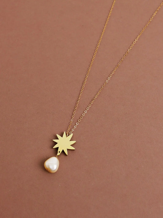 The Every Space Kara necklace with gold filled chain and brass pendant by Wolf & Moon