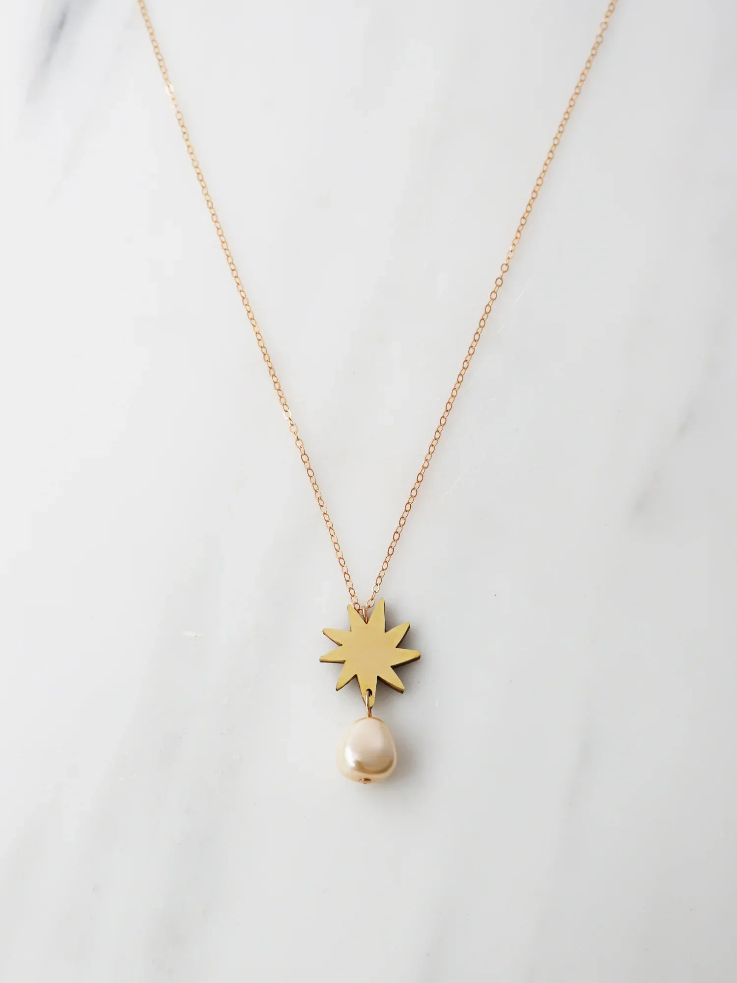 The Every Space Kara necklace with gold filled chain and brass pendant by Wolf & Moon