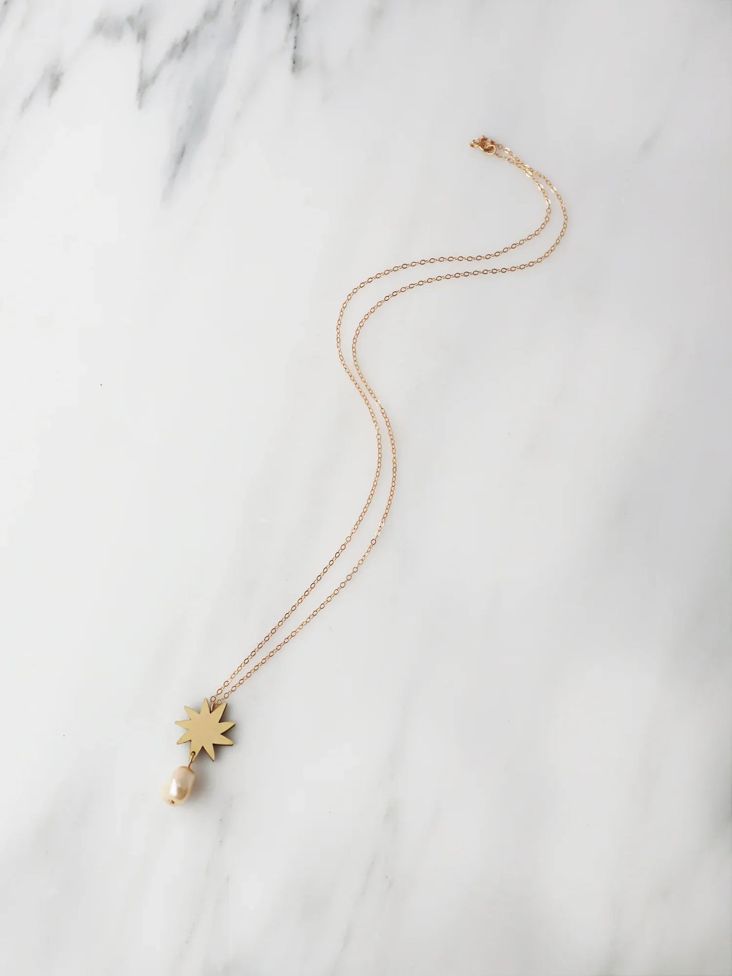 The Every Space Kara necklace with gold filled chain and brass pendant by Wolf & Moon
