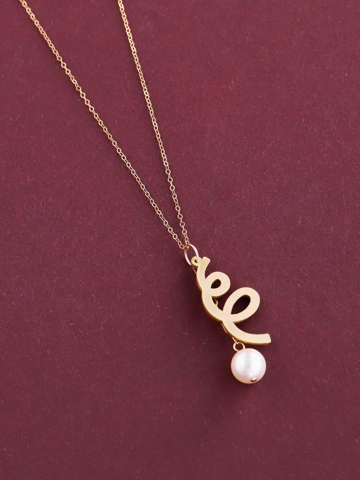 The Every Space Lola necklace with gold filled chain and brass & glass purl pendant by Wolf & Moon