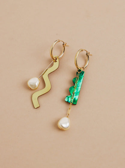 The Every Space mismatched Martha hoop earrings with gold filled hoops and emerald & brass charms by Wolf & Moon
