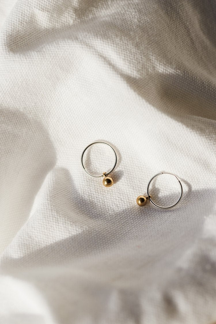 The Every Space Mini Emily earrings with sterling silver hoops and brass pendants by Roake Studio