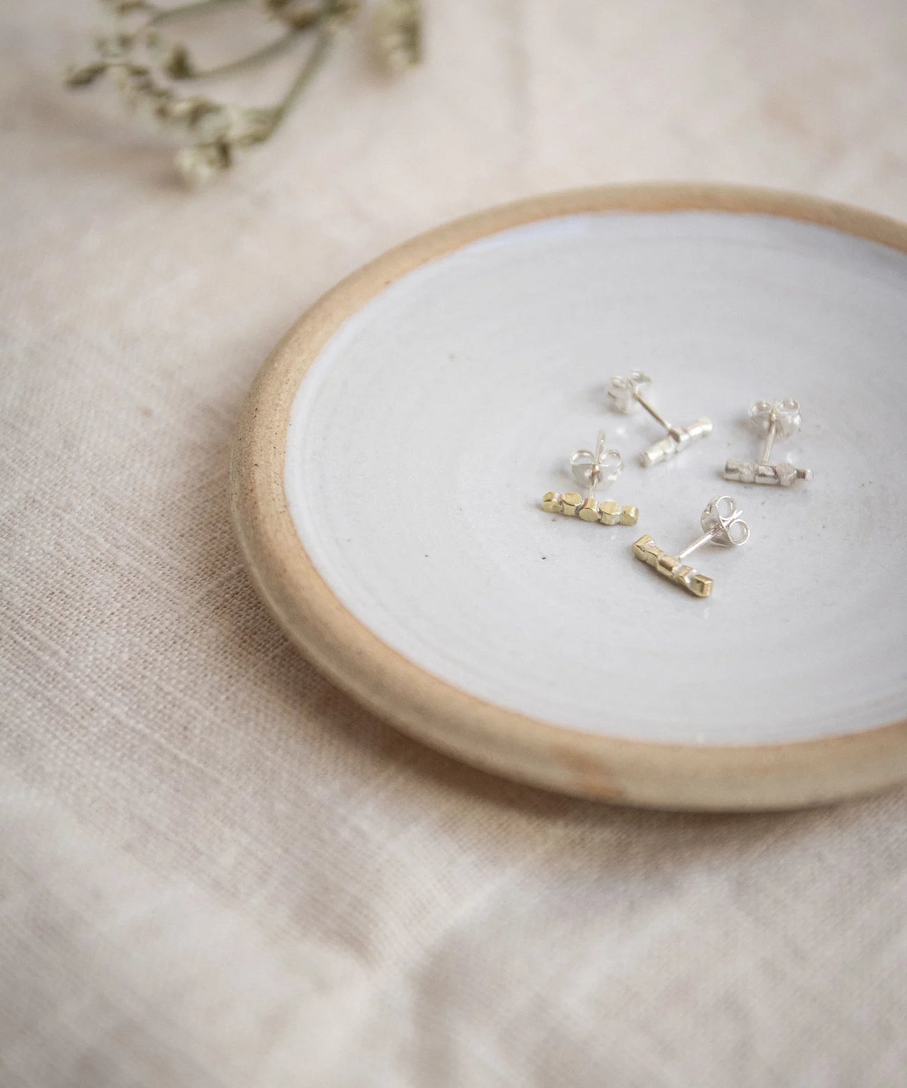 The Every Space Nerth bar stud earrings in sterling silver or brass by Clare Elizabeth Kilgour