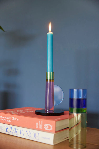 The Every Space Astro candle holder in pink, yellow, blue, and green crystal glass by Hübsch
