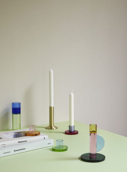 The Every Space Astro candle holder in pink, yellow, blue, and green crystal glass by Hübsch