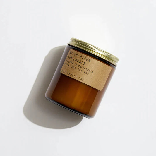 Piñon 7.2 oz Soy Candle, hand-poured into apothecary-inspired amber jars with signature kraft label and a brass lid, by PF Candle Co.