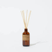 Sandalwood Rose 3 fl oz reed diffuser with fine fragrance oil in a 4 oz amber apothecary-inspired bottle with rattan reeds, by PF Candle Co.