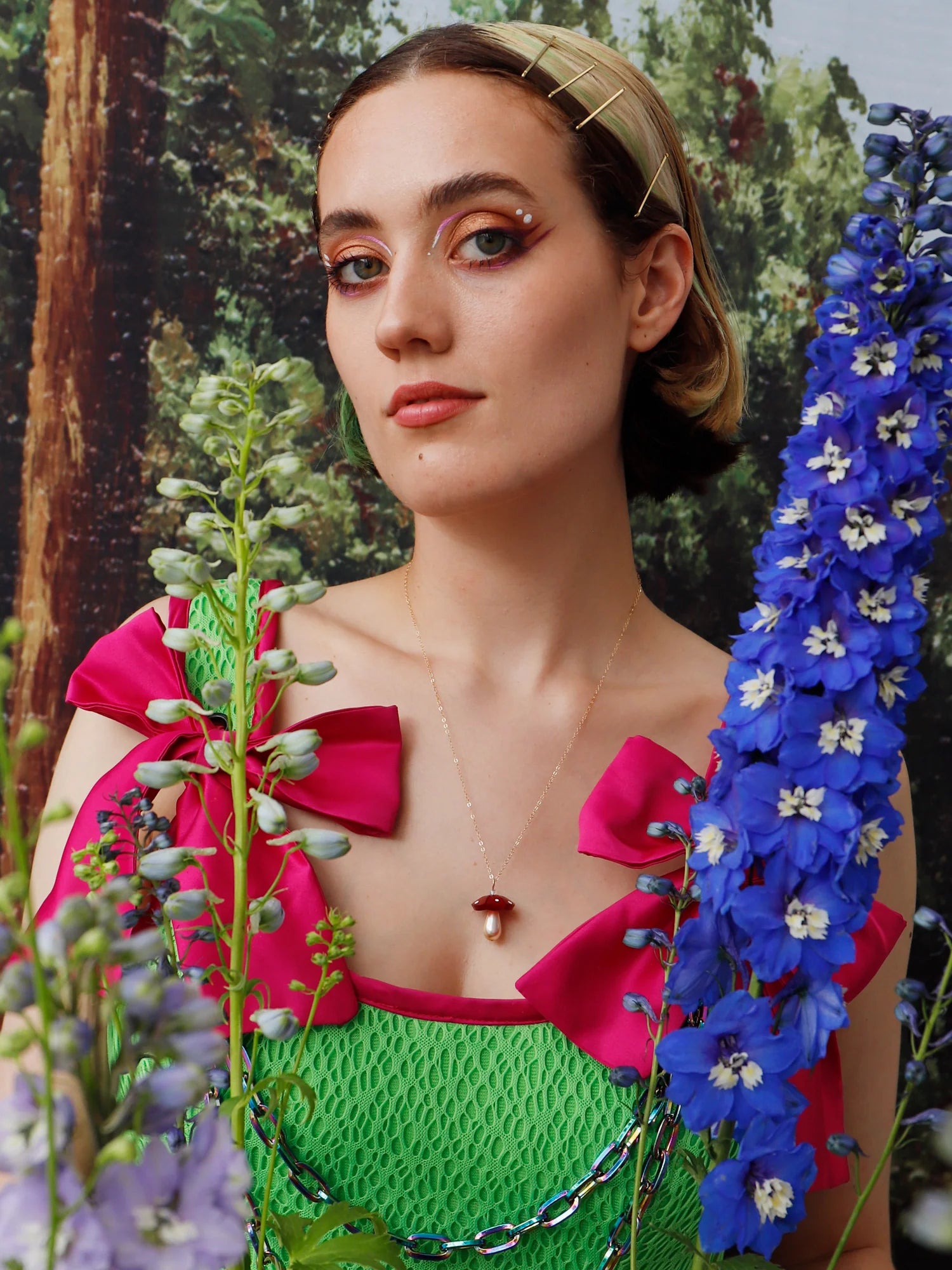 The Every Space Shroom necklace with gold filled chain and red marbled acrylic and glass pearly mushroom pendant by Wolf & Moon