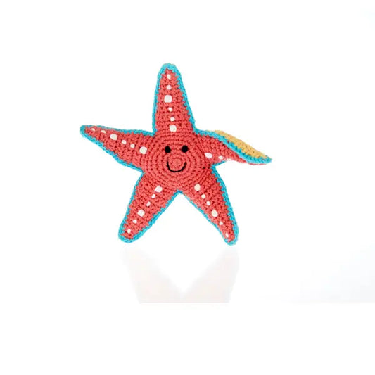 The Every Space handmade new baby coral Starfish Rattle crocheted in organic cotton with polyester fill by Pebble Child